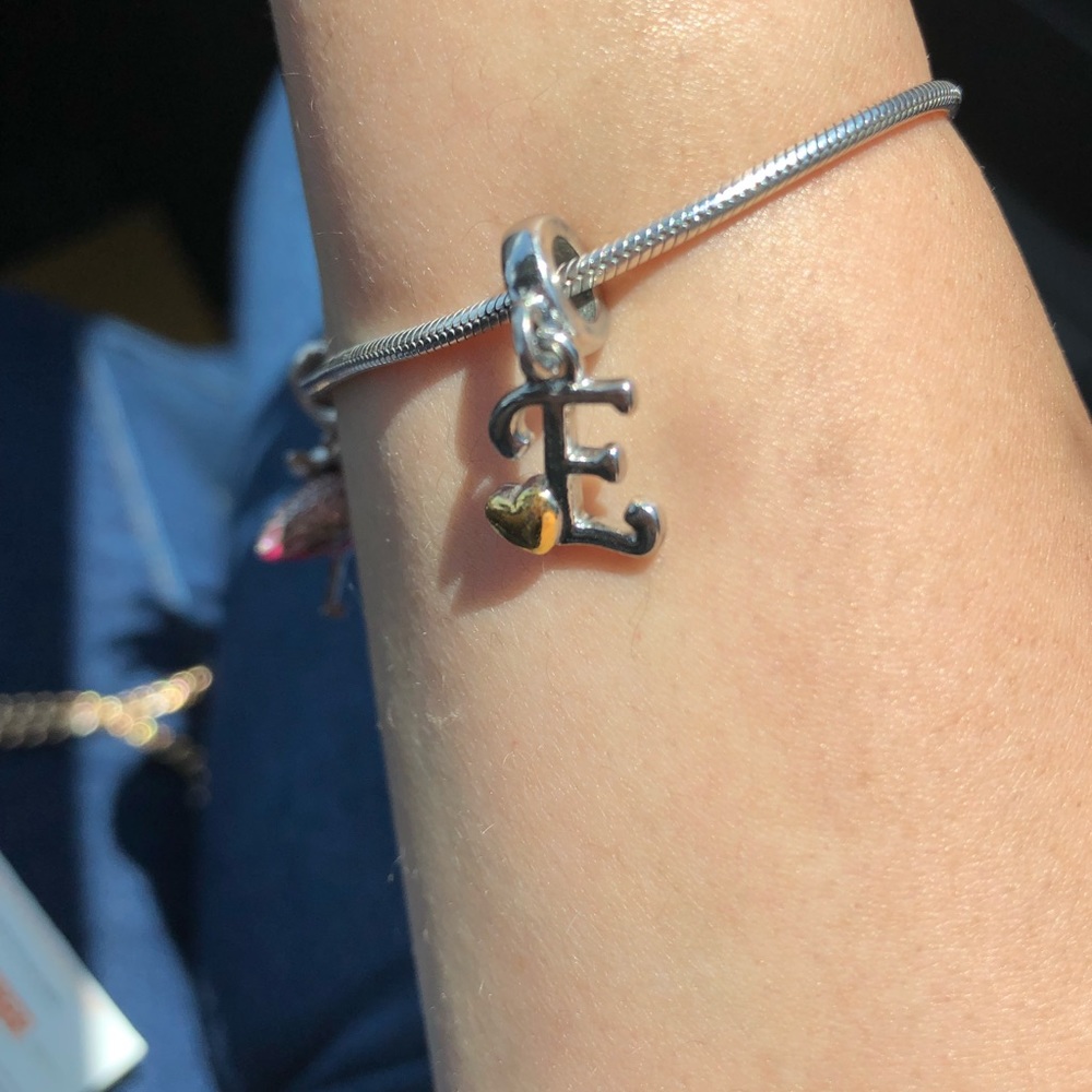 Initial E charm